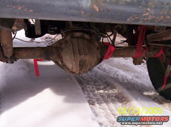 rear axle with red straps, snow on ground, date stamp 02/13/2005
