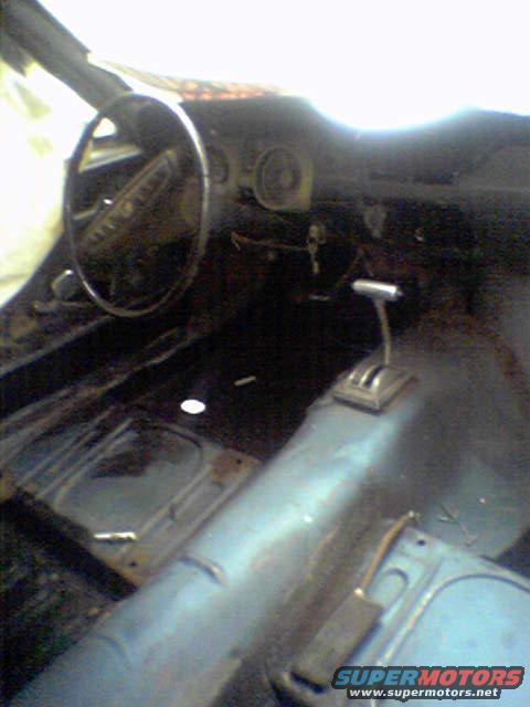 1968 Ford Mustang interior showing dashboard, steering wheel, and floor shifter