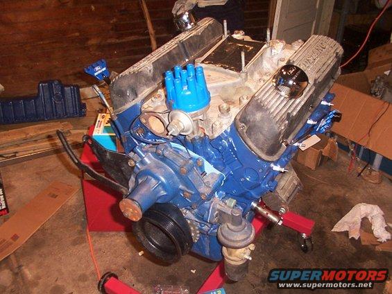 1968 Ford Mustang V8 engine on red stand, blue painted block and valve covers