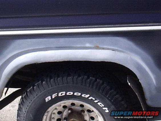 Close-up of a BFGoodrich tire on a vehicle's rear wheel well