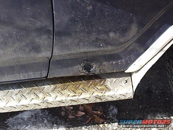 Rusted rocker panel with diamond plate step