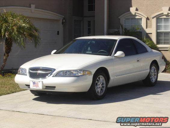 White 1997 Lincoln Mark VIII coupe parked in driveway