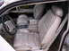 1992 Lincoln Mark VII - The interior of a car shows tan leather seats and the dashboard area.