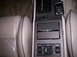 1992 Lincoln Mark VII - Close-up of a car's center console and seats, showing the gear shifter and power window controls.