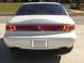 1997 Lincoln Mark VIII - Rear view of a 1997 Lincoln Mark VIII, showing its distinctive taillight bar and badging.