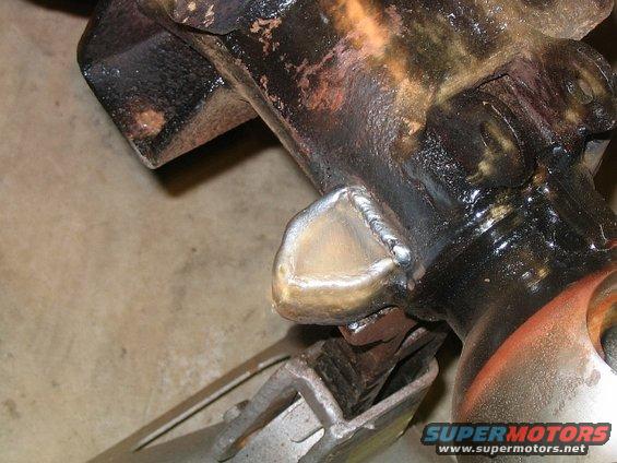 Close-up of a metal part with fresh welds