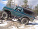 1979 Ford Bronco - Modified 1979 Ford Bronco navigating a rocky, snowy trail.