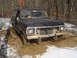 1979 Ford Bronco - This vehicle is stuck in a muddy, wooded area during winter.