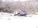1979 Ford Bronco - This SUV is navigating a challenging, snow-covered terrain with sparse vegetation.