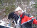 1979 Ford Bronco - Two men are in a wooded area with snow on the ground, one is smiling and wearing a red and black jacket.