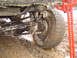 1979 Ford Bronco - A hi-lift jack is used to help free a muddy off-road vehicle stuck in the mire.