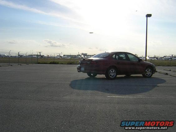 1997 Ford Taurus parked in an airport lot, side view
