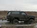 1985 Ford Bronco - This 1985 Ford Bronco is deeply stuck in a muddy, marshy area.