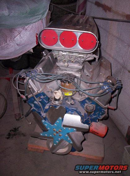 Engine with chrome air cleaner, red filter elements, and blue valve covers