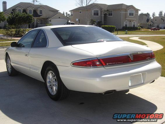 White 1997 Lincoln Mark VIII rear 3/4 view, parked on concrete driveway