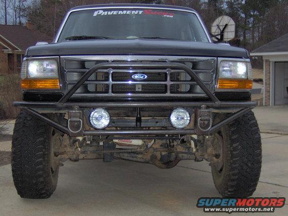 Black Ford Bronco front view with custom bumper and off-road tires