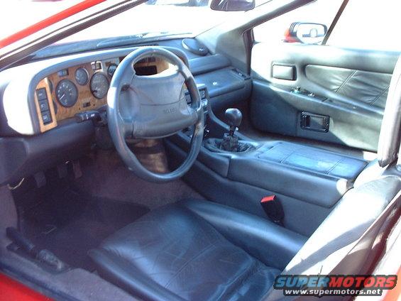 Interior... mostly stock. The steering wheel is actually upside-down due to my backing the car into its position
