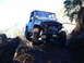 1990 Ford Bronco - This classic Toyota Land Cruiser FJ40 navigates a challenging, muddy off-road course.
