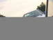 1998 Volkswagen Jetta - Partial view of a blue sedan from the front-right angle.