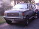 1991 Ford Bronco - The front end of a two-tone Ford Bronco is visible, with a license plate reading 292M024.