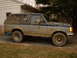 1991 Ford Bronco - This 1991 Ford Bronco is heavily covered in mud after off-road use.