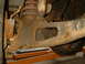 1982 Ford Bronco - Close-up of heavily rusted vehicle suspension parts and differential, with a website watermark visible.
