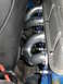 1968 Ford Mustang - Engine exhaust headers and spark plugs are shown in this close-up view.