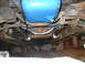 1968 Ford Mustang - Underside view of chrome headers and transmission bell housing, with a blue oil pan visible.