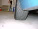 1998 Volkswagen Jetta - Close-up view of a tire and fender on a blue vehicle.