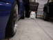 1998 Volkswagen Jetta - A blue sedan and a black Jeep are parked in a garage, with storage bins and a trash bag nearby.