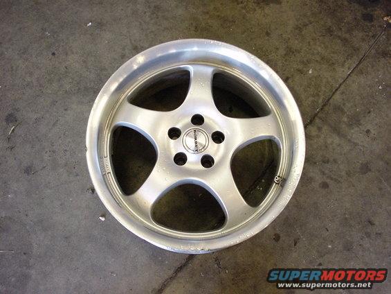Silver Borbet alloy wheel with five spokes and center cap