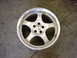 1998 Volkswagen Jetta - A single silver Borbet alloy wheel is shown against a concrete floor.