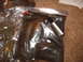 1988 Ford Bronco - Several items are sealed in plastic bags, with a marker visible in one.