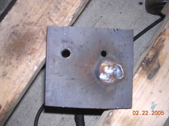 weldedin.jpg Welded in place.  I moved the center bolt back 1.5 inch and out 1.5 inch to help the coil sit more level.