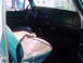 1978 Ford Bronco - The interior of an older vehicle shows worn seats and a dashboard with a radio.