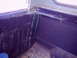 1978 Ford Bronco - The interior corner of this 1978 Ford Bronco shows signs of disuse with accumulated dust and spiderwebs.
