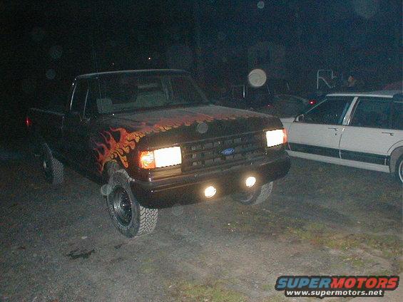 Black 1991 Ford F-150 with flame decals, 3q-front view