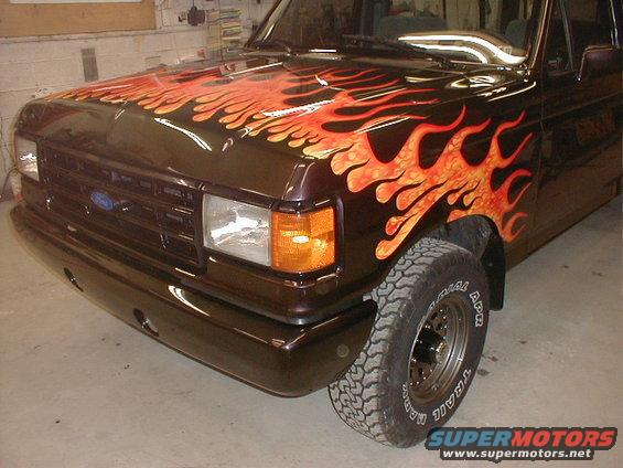 Dark brown 1991 Ford F-150 with custom flame paint job