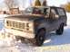 1985 Ford Bronco - This 1980s Ford Bronco is parked in the snow with a cracked windshield.