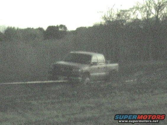 Pickup truck in a grassy field
