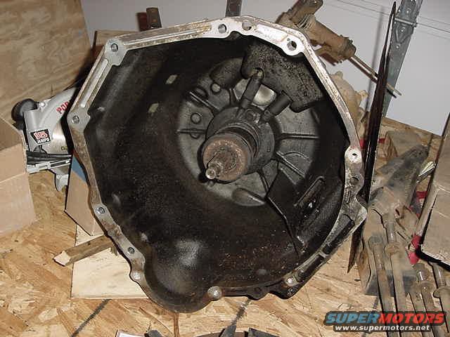 Transmission bell housing interior view, on a wooden surface