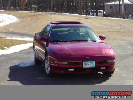 Red 1993 Ford Probe coupe with sunroof and Minnesota license plate FNP-073