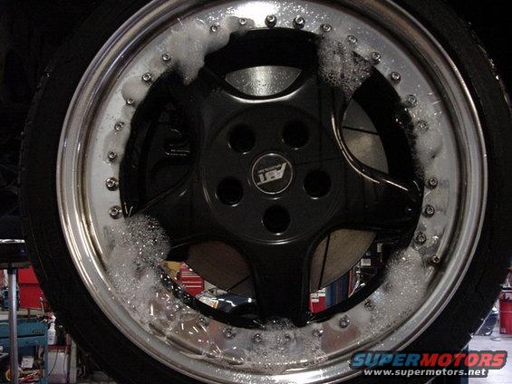 car wheel with ABT logo being washed
