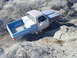1978 Ford Bronco - Pickup truck navigates a rocky off-road trail.