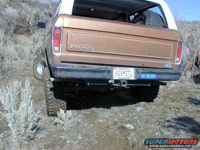 1978 Ford Bronco rear view, brown exterior, spare tire visible inside
