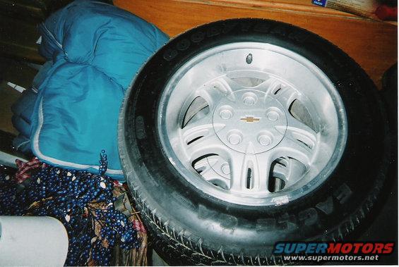 Close-up of a tire and silver alloy wheel with a Chevrolet emblem