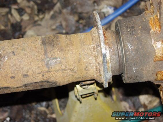 Rusty axle part on a jack stand