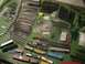 1981 Chevrolet C/K Pickup - A collection of model train tracks and rolling stock is spread out on a green surface.