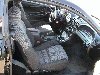 Interior view of a car, showing the driver's seat and dashboard