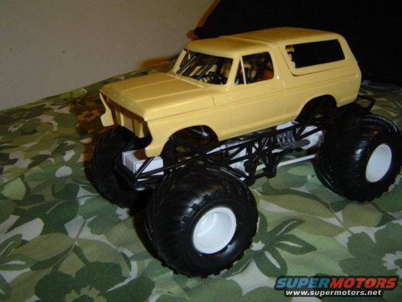 Yellow 1979 Ford Bronco monster truck model, 3q-front view